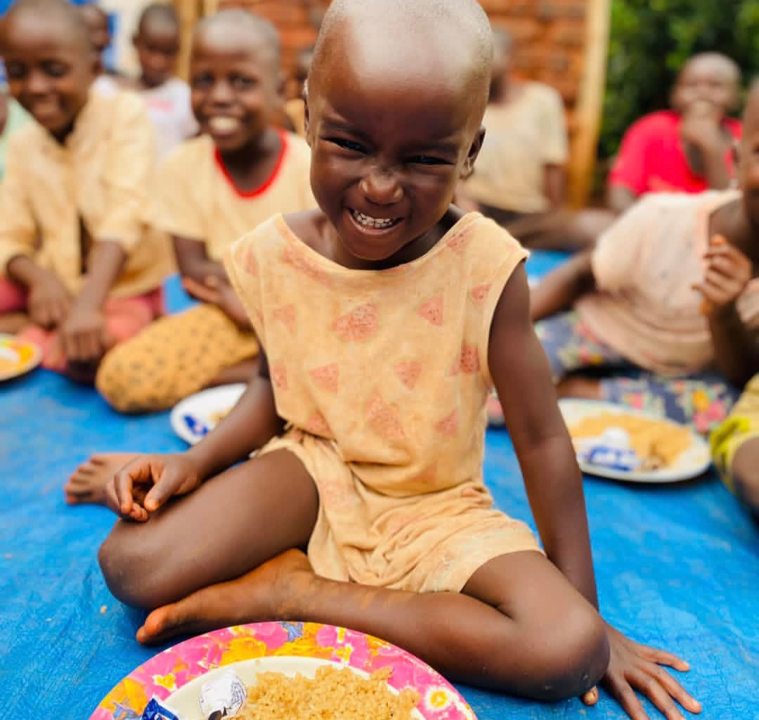 Joyful child healing through love at Kwaja Uganda