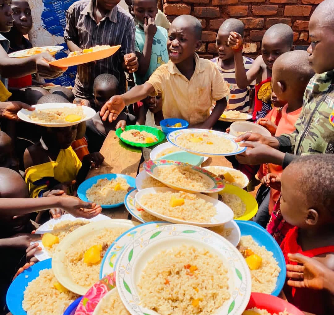 Children receiving nutritious meals at Kwaja Uganda